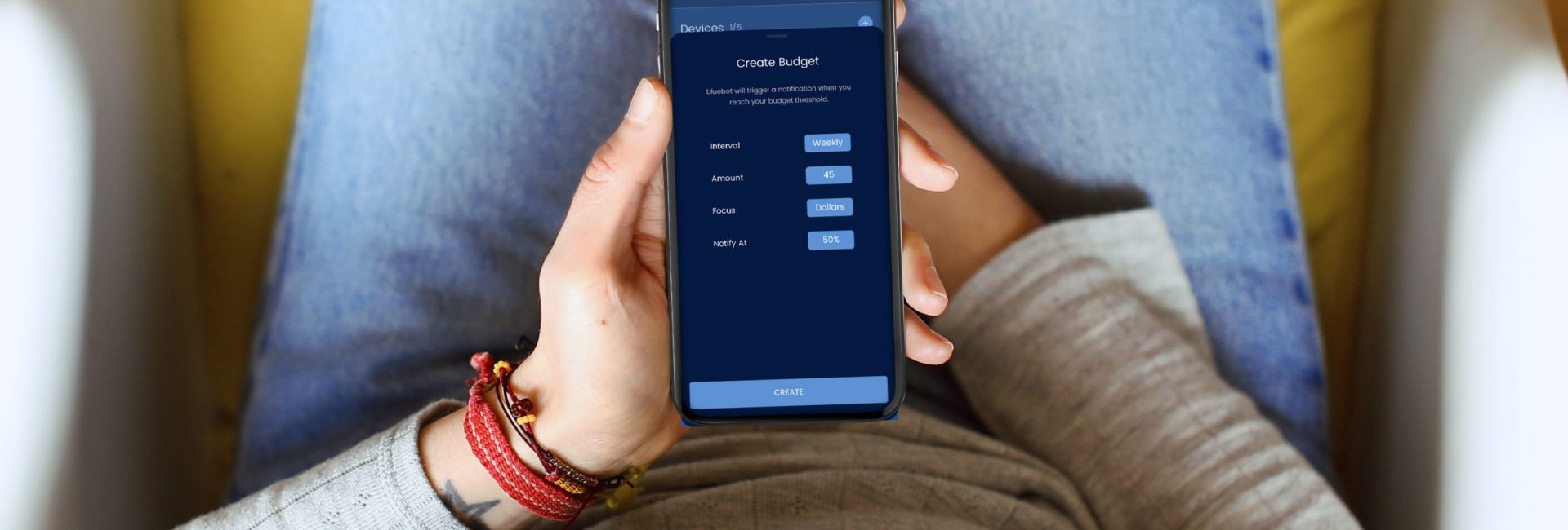 Girl-sitting-with-bluebot-app-in-home-setting-budget-1