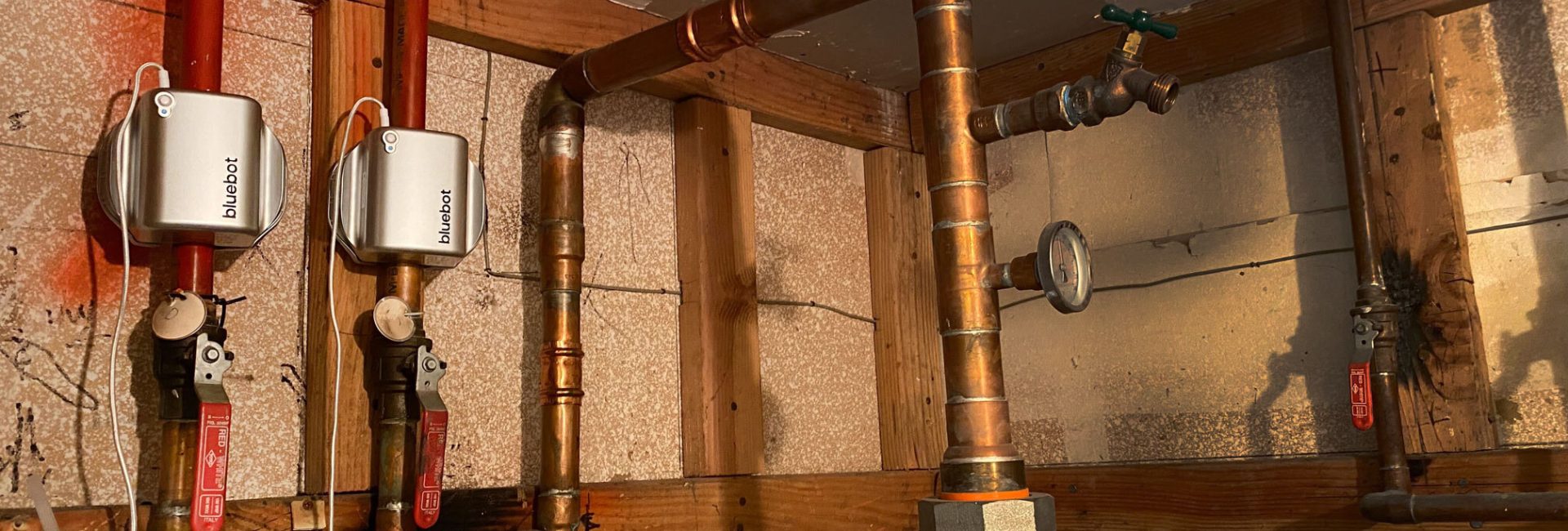 bluebot installed on hot water lines of a multi-unit rental property